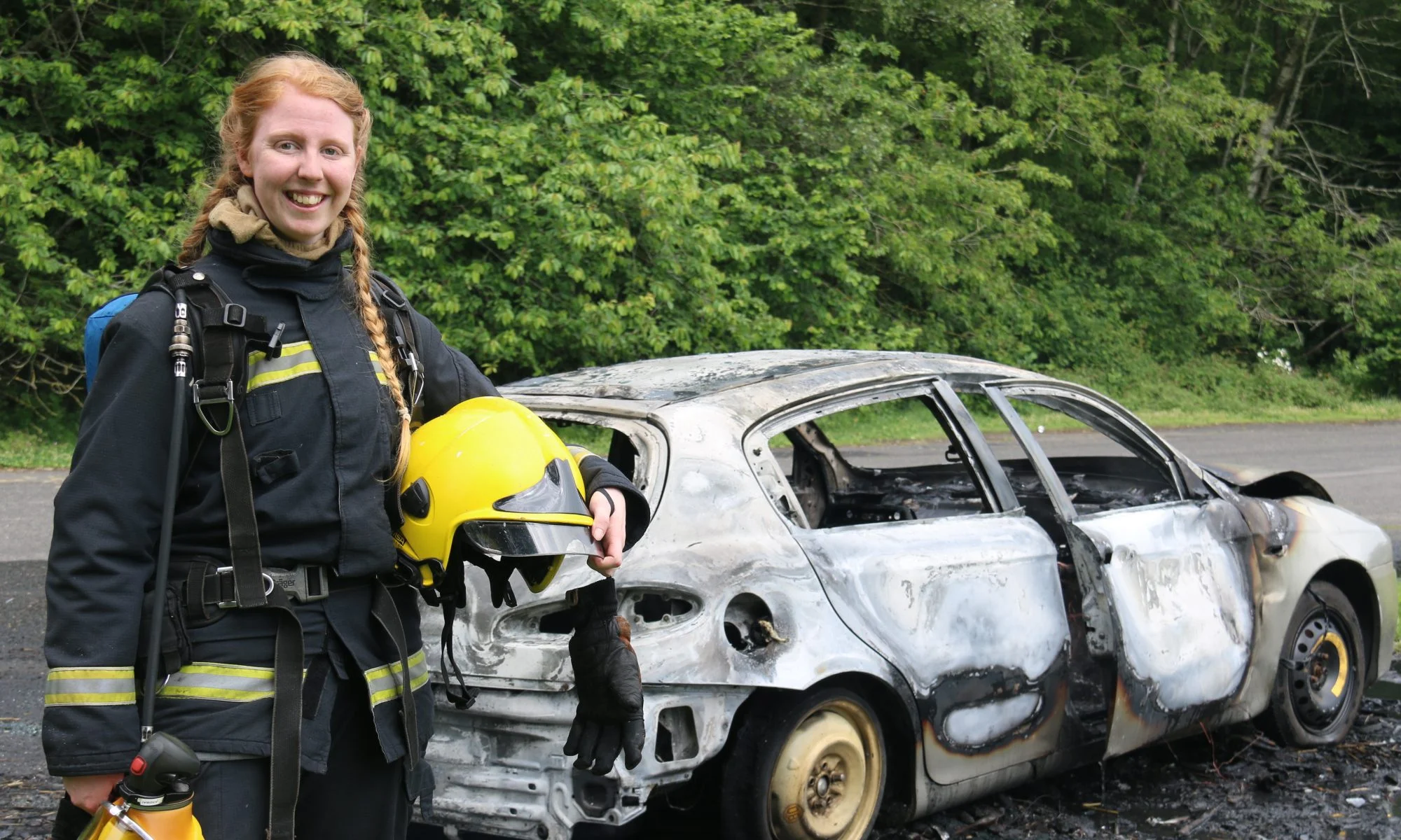 WFS member, standing next to a car during car fire training.