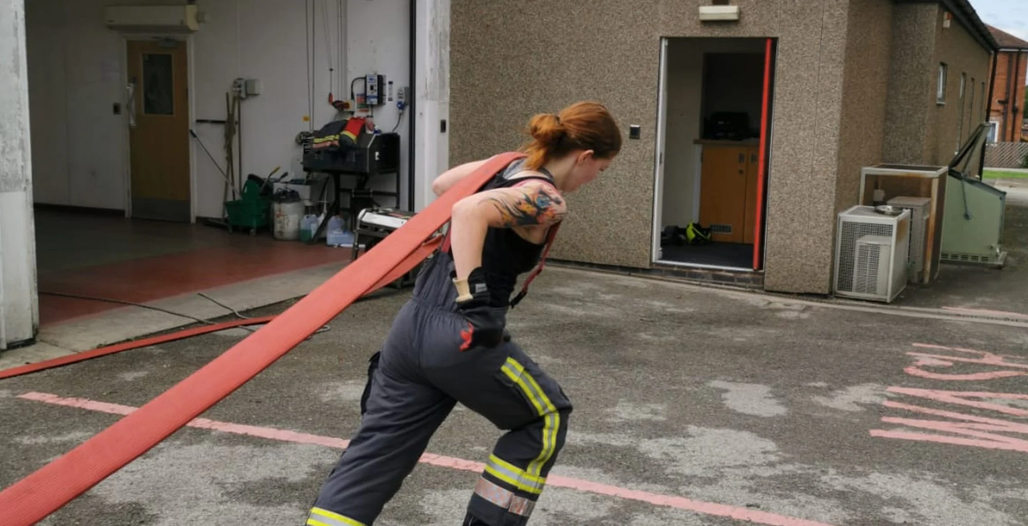 Firefighter on hose drag exercises