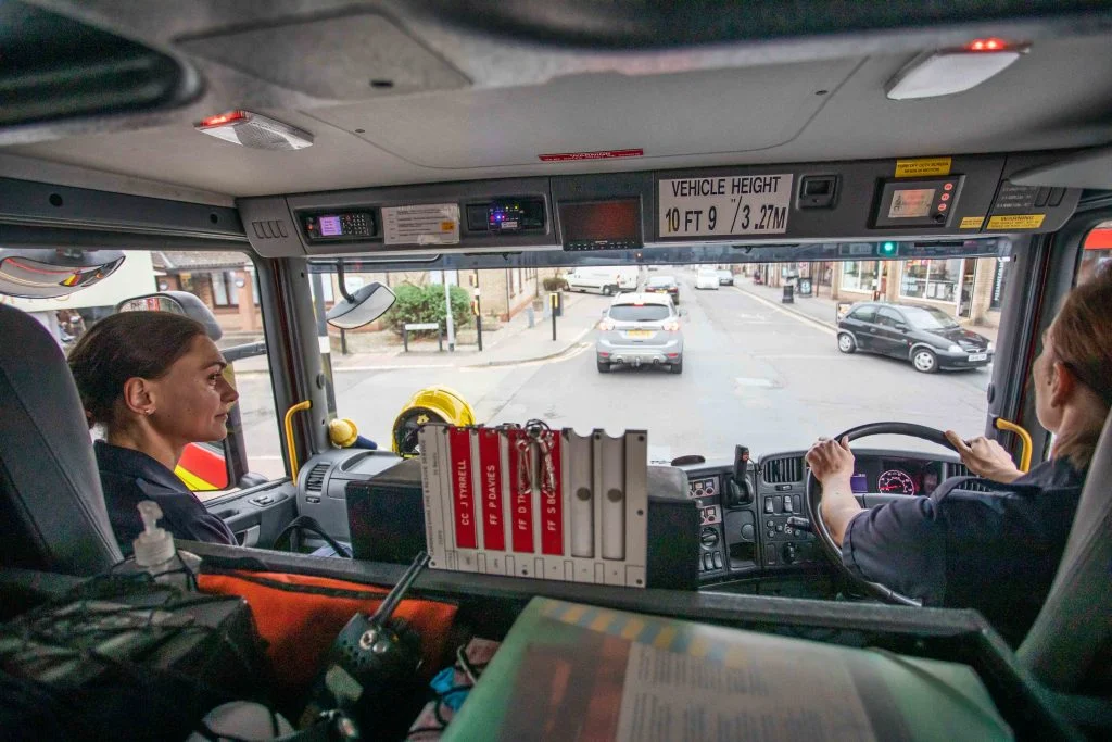 Firefighter Agata sitting next to the driver in the fire appliance