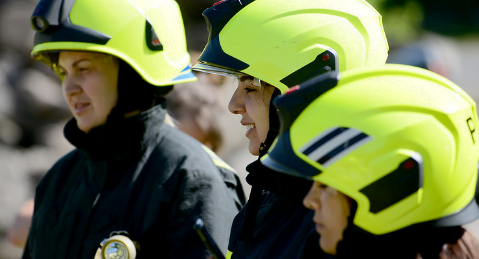 Three women firefighters standing together