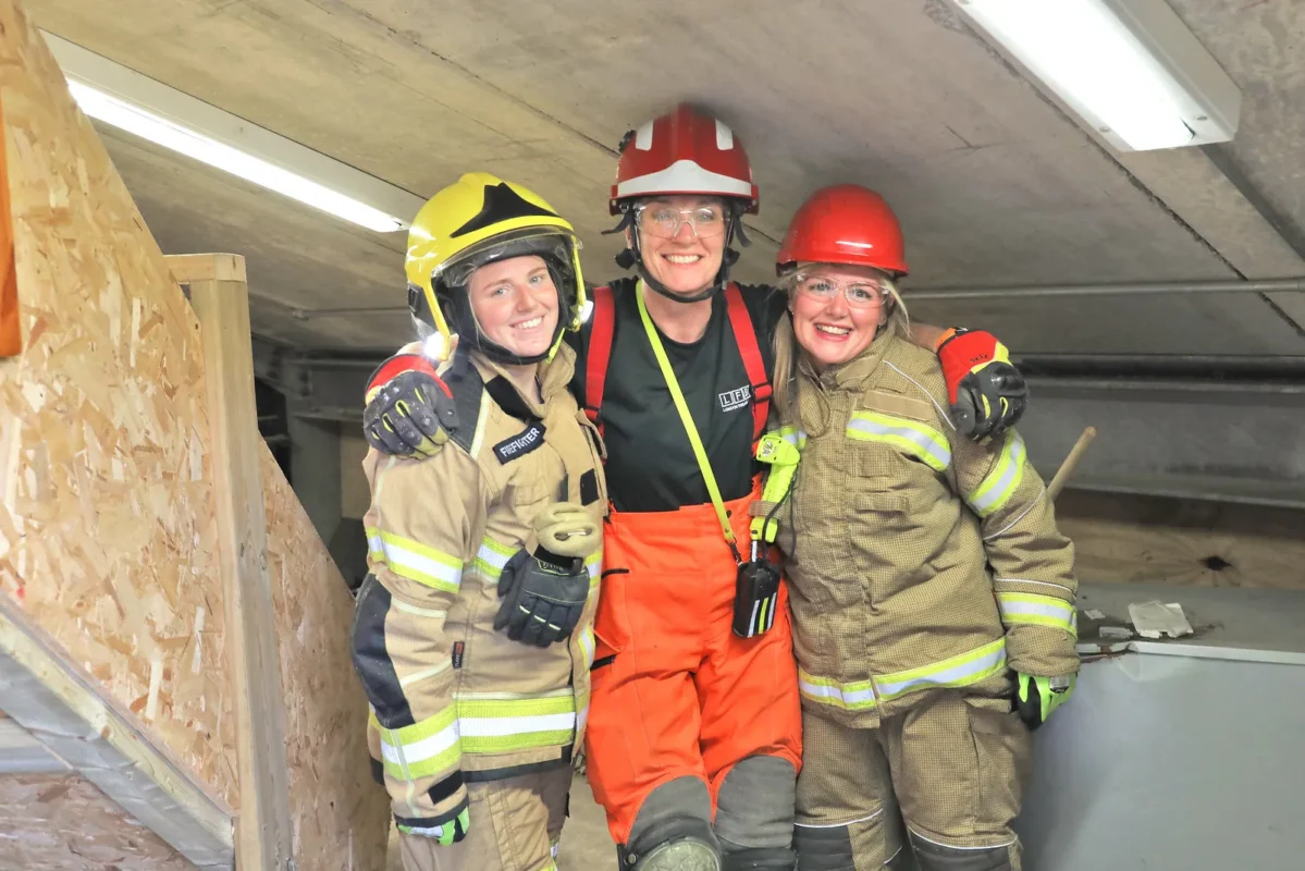 3 female fire fighters on a training exercise